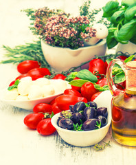 Tomatoes, mozzarella and olive oil. Caprese salad ingredients