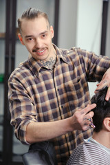 Barber cuts hair of a man