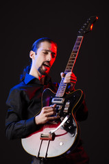 Fototapeta premium Man with guitar during concert