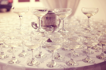 Many glasses of wine on table