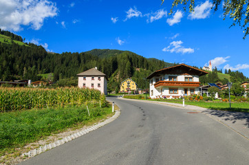 Fototapeta na wymiar Road in Strassen alpine village in Dolomites Mountains, Austria