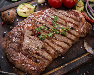 Beef rump steak on black stone table