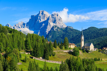 Fototapeta na wymiar View of Pian village with church in Dolomites Mountains, Italy