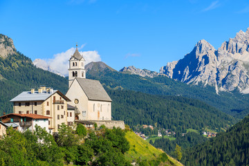 Fototapeta na wymiar View of church in Pian village in Dolomites Mountains, Italy