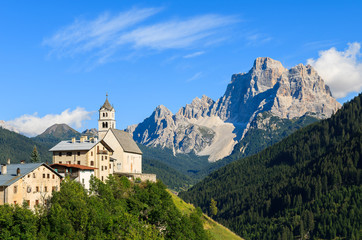 Fototapeta na wymiar View of church in Pian village in Dolomites Mountains, Italy