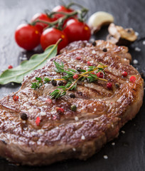 Beef rump steak on black stone table