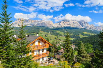 Fototapeta na wymiar Alpine house in La Villa village in Dolomites Mountains, italy