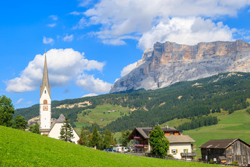 View of La Villa village church in Dolomites Mountains, italy