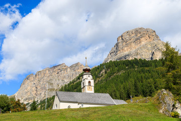 Church in Colfosco alpine village, Dolomites Mountains, Italy