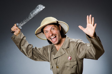 Funny safari hunter against background