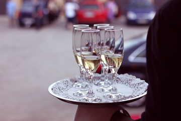 Elegant champagne glasses on tray