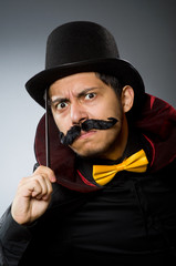 Funny magician man with wand and hat