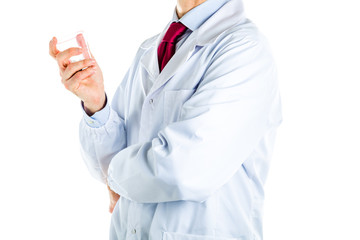 Doctor in white coat holding a glass of steel bolts