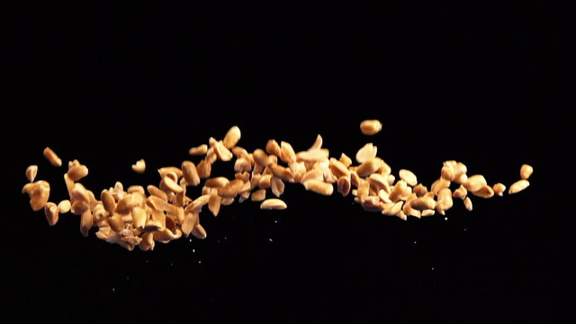 SLOW: Peanuts fly up and fall
