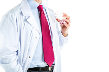 Doctor in white coat holding glass full of dice