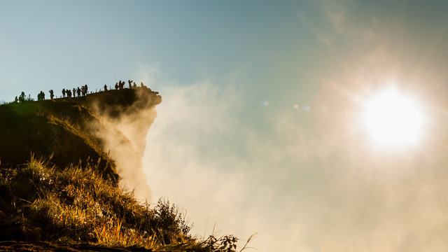 Sunrise with the peak of mountain and fog at Phu chi fa Thailand