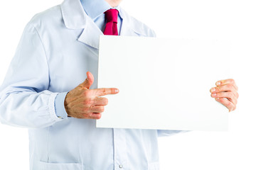 Doctor in white coat showing a white blank signboard