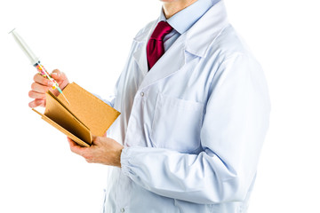 Doctor in white coat holding cork book and syringe