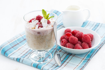 healthy dessert with oatmeal, whipped cream and raspberries