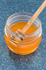 jar with fragrant honey, vertical, close-up