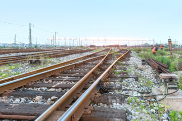 Fototapeta na wymiar Cargo train platform at sunset with container