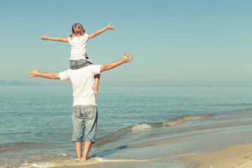 Fototapeta na wymiar Father and daughter playing on the beach.