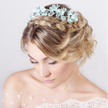 elegant beautiful girl in image of bride with flowers in hair