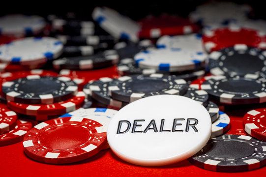 dealer button and chips for poker
