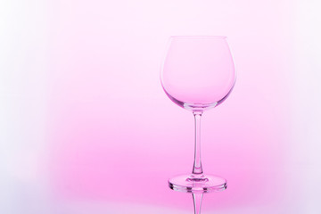 Empty wine glass. isolated on pink background