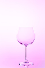 Empty wine glass. isolated on pink background