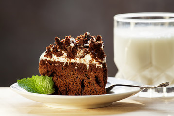 Delicious chocolate cake on plate on table