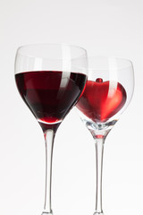 Wine glasses with red wine and heart
