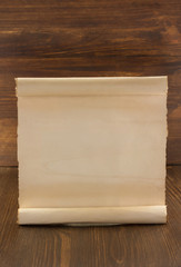 parchment scroll on wood