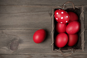 Red Easter eggs in basket