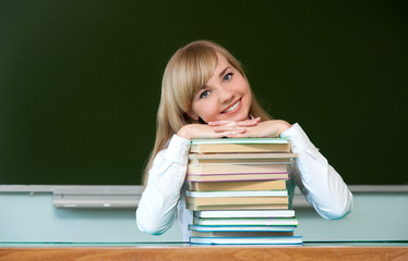 cheerful girl with textbooks
