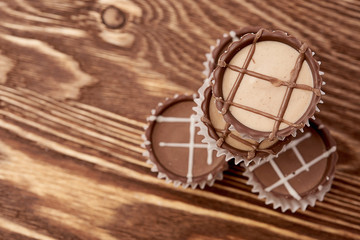 Fototapeta na wymiar Dark chocolate on wooden background