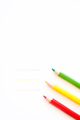 colored pencils on a white sheet of paper