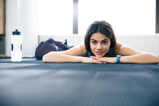 Cute young woman lying on the floor