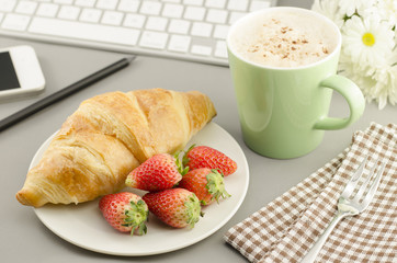 Breakfast with croissant,coffee and strawberry