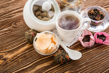 Tea cups with teapot on old wooden table