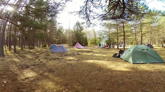 campsite with tents in forest