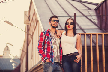 couple in sunglasses standing in the city
