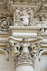Fototapeta na wymiar Sculptures at the Santa Croce baroque church in Lecce, Italy