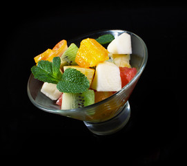 Fruit salad on a black.
