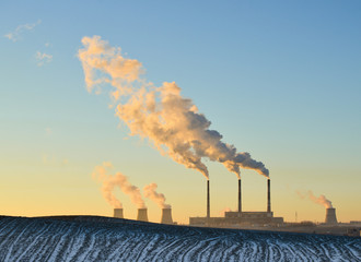 Winter landscape with factory chimneys