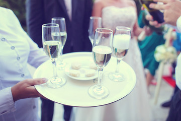 Waiter serving champagne