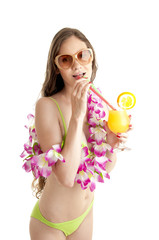 Portrait of beautiful woman in bikini wearing flower lei garland