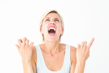 Upset woman screaming with hands up