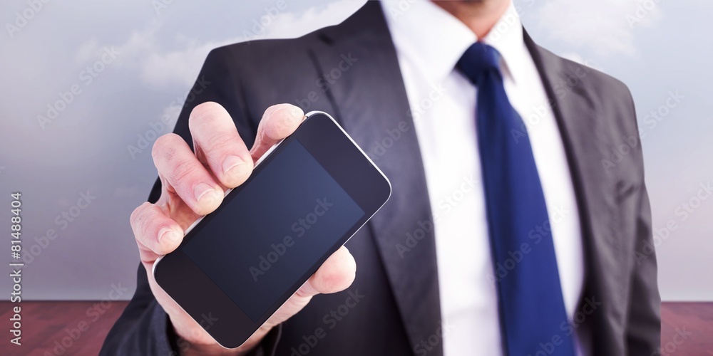 Poster composite image of businessman showing his smartphone screen
