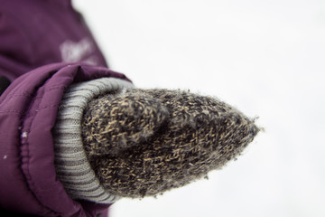 Children's hand in the mitten